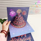 Tarjeta de cumpleaños con fuegos artificiales, tarta emergente y música